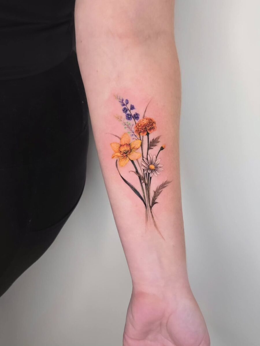 This tattoo features beautiful flowers like daffodils and daisies, symbolizing new beginnings and joy.