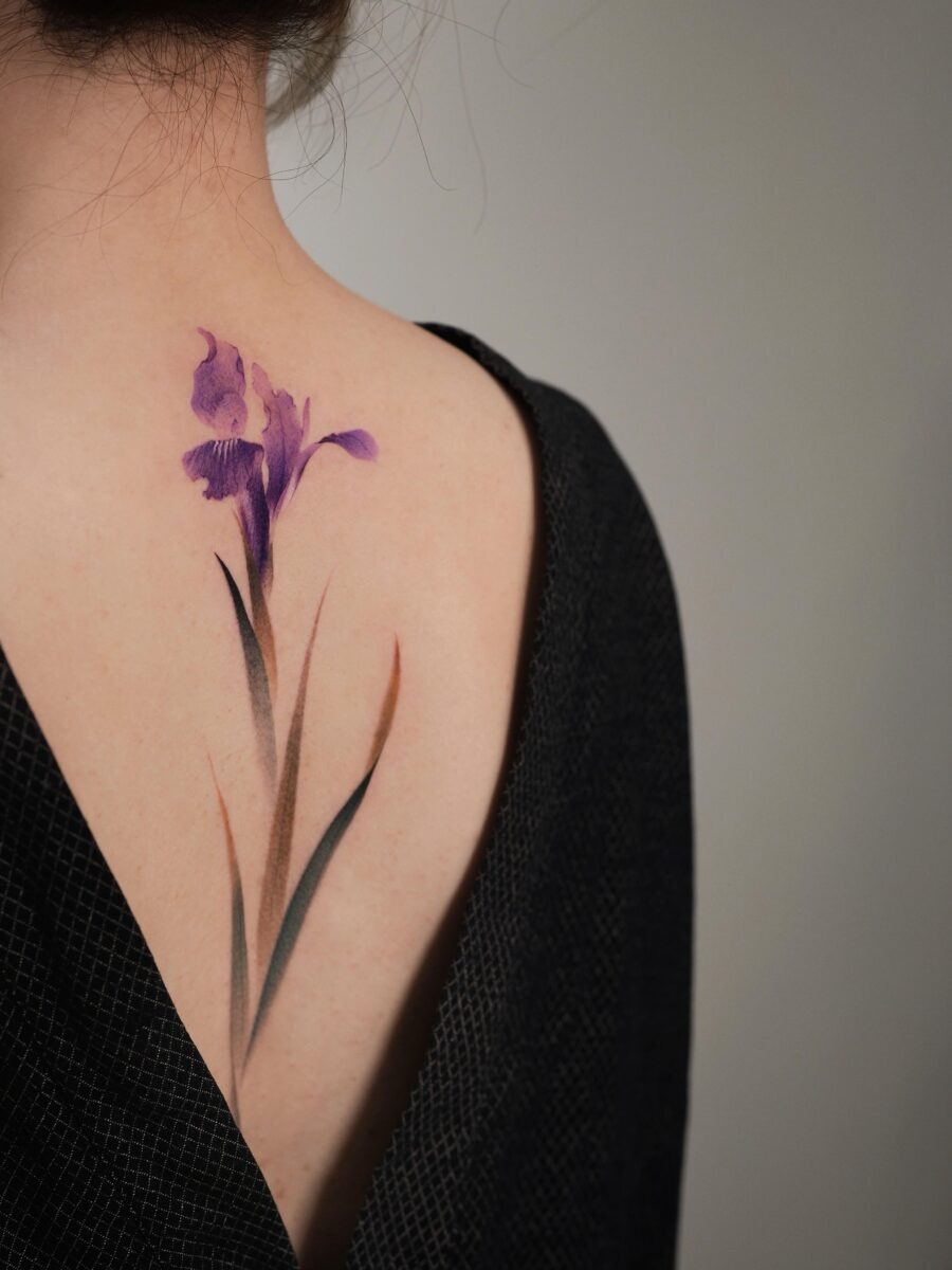 This iris tattoo graces the back with its elegant design.