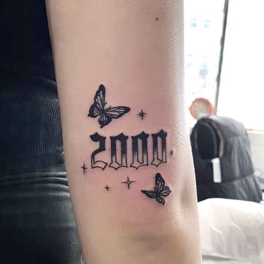 Butterfly-Framed 2000 Birth Year Tattoo Design