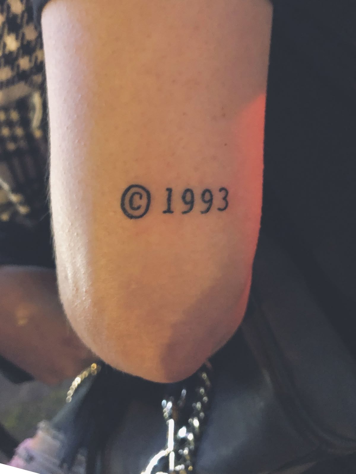 Copyright-Style 1993 Minimal Mark Tattoo Design