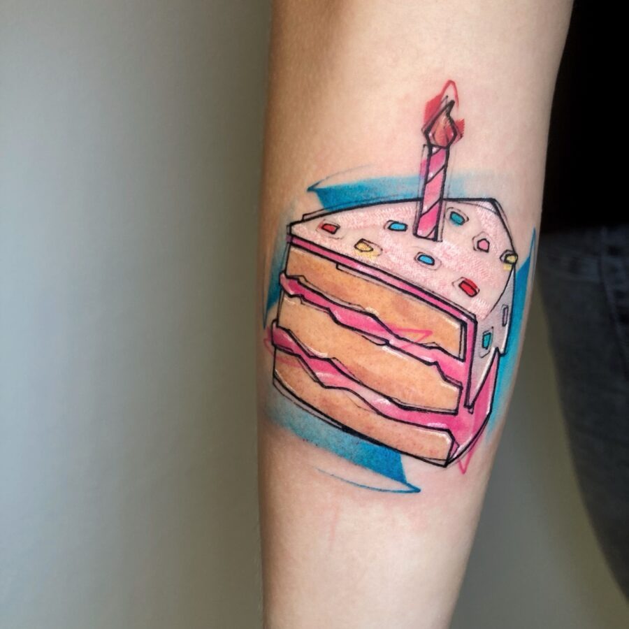 This cake slice tattoo captures the joy of birthday celebrations.