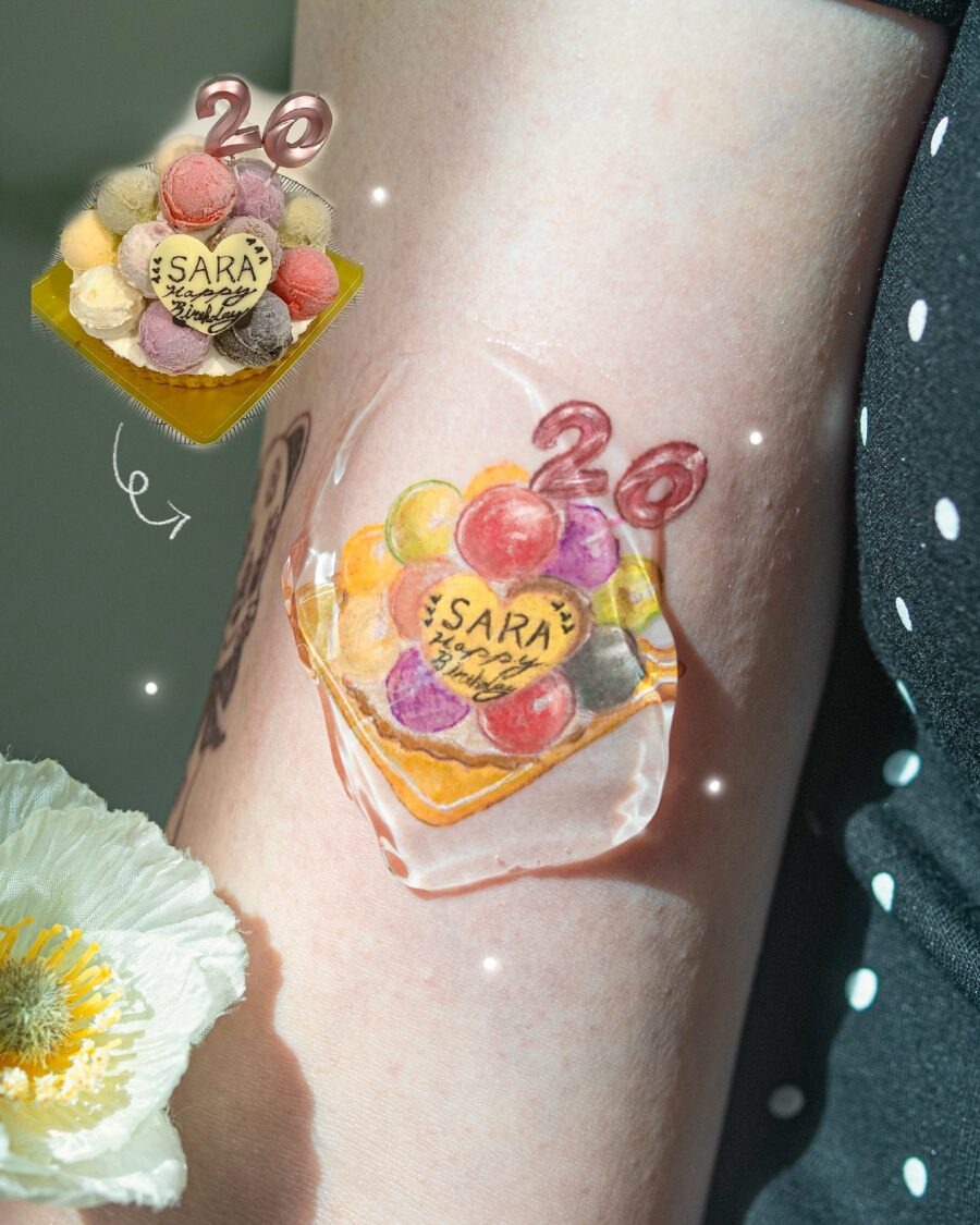 This tattoo celebrates a special birthday with a playful ice cream cone design.