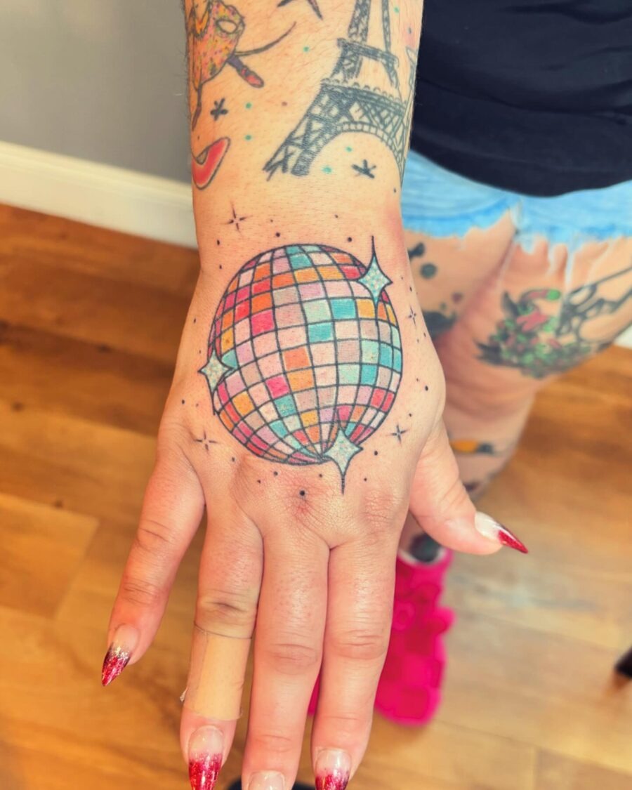 This colorful disco ball tattoo captures a fun, party vibe.