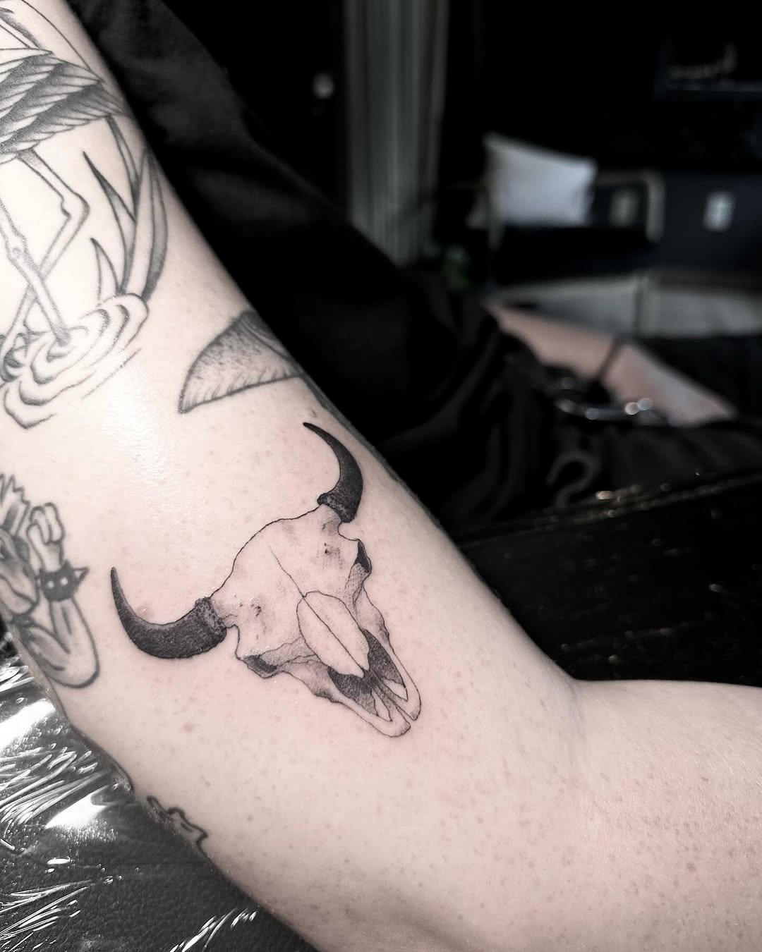 This tattoo showcases a beautifully detailed bison skull.