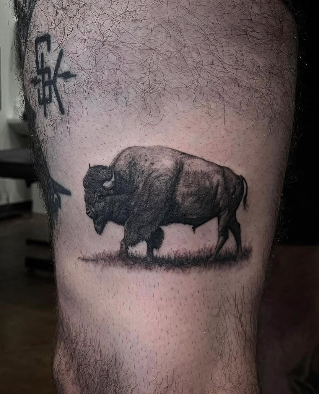 This captivating bison tattoo showcases an intricate and realistic design.