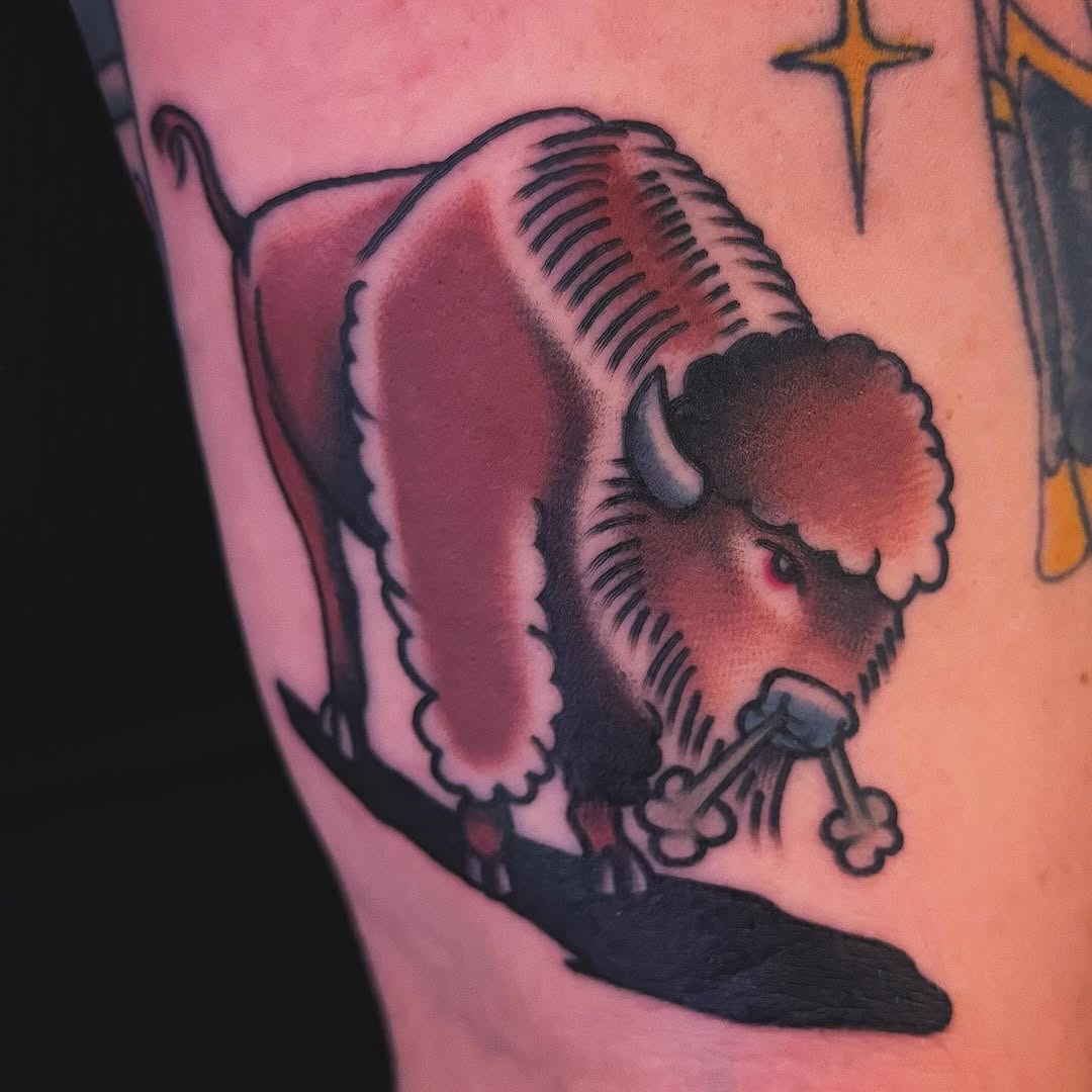 This bison tattoo showcases a carefully crafted design with rich colors and detailed shading.