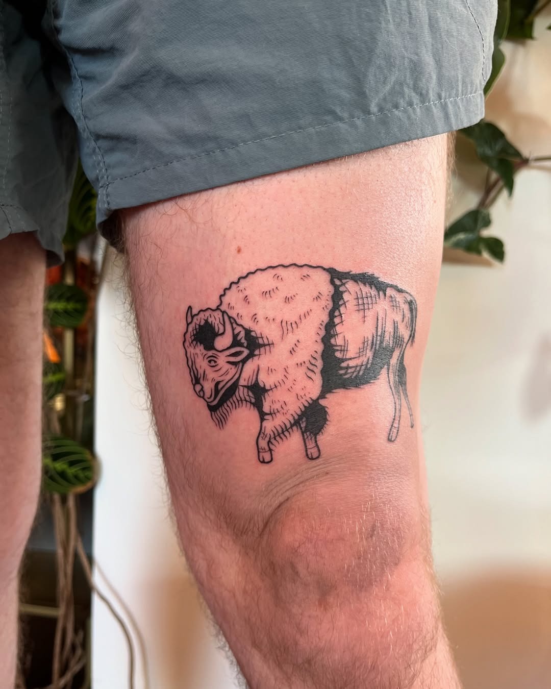 This tattoo features a detailed bison, showing its majestic presence and natural beauty.