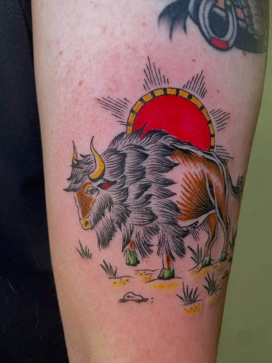 This stunning bison tattoo features a richly detailed design, emphasizing the animal's majestic form.