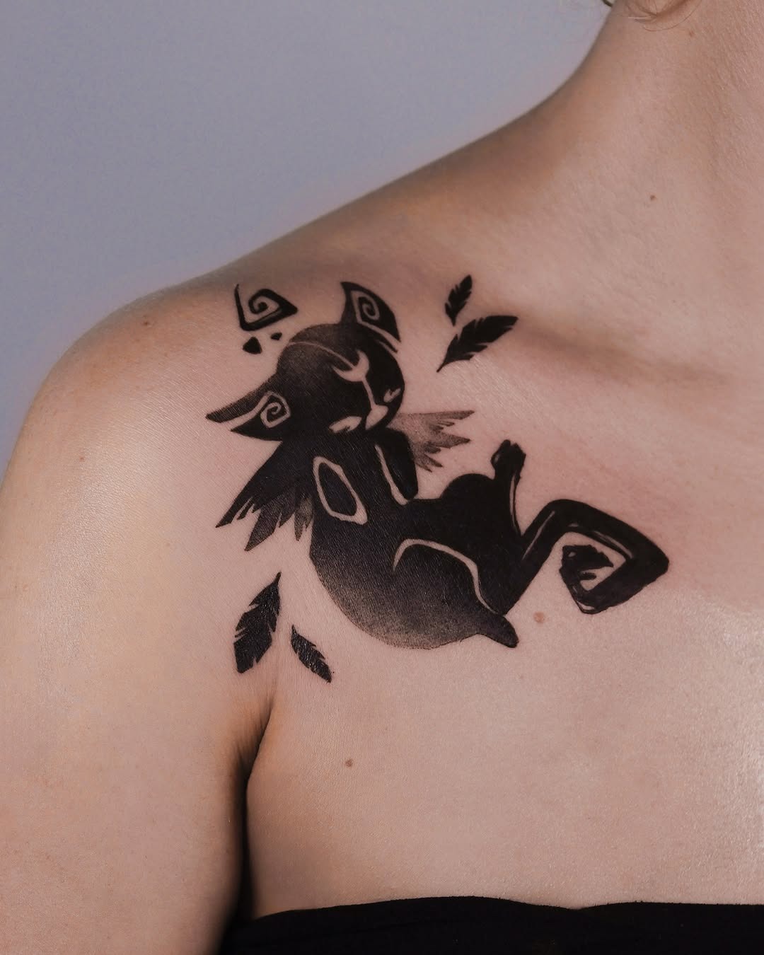 Charming Black Cat Tattoo with Feathers Tattoo Design