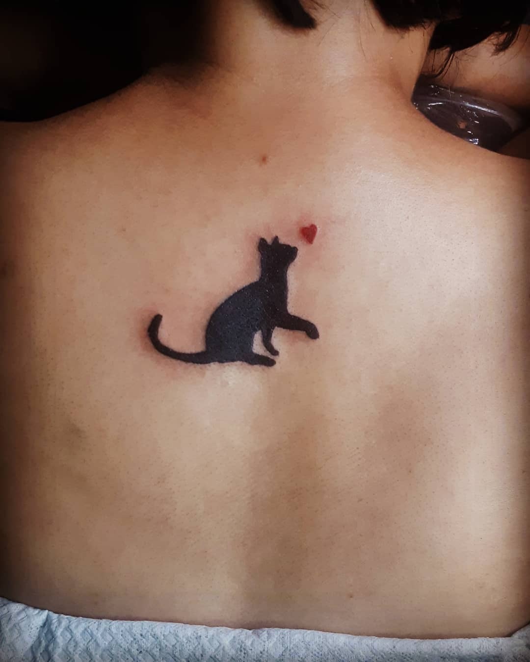 Charming silhouette of a black cat tattoo Tattoo Design