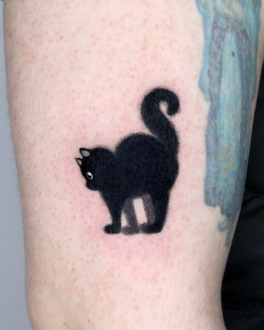 Charming silhouette of a playful black cat Tattoo Design