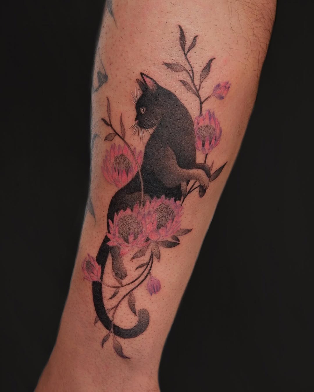 Elegant black cat amidst blooming flowers Tattoo Design