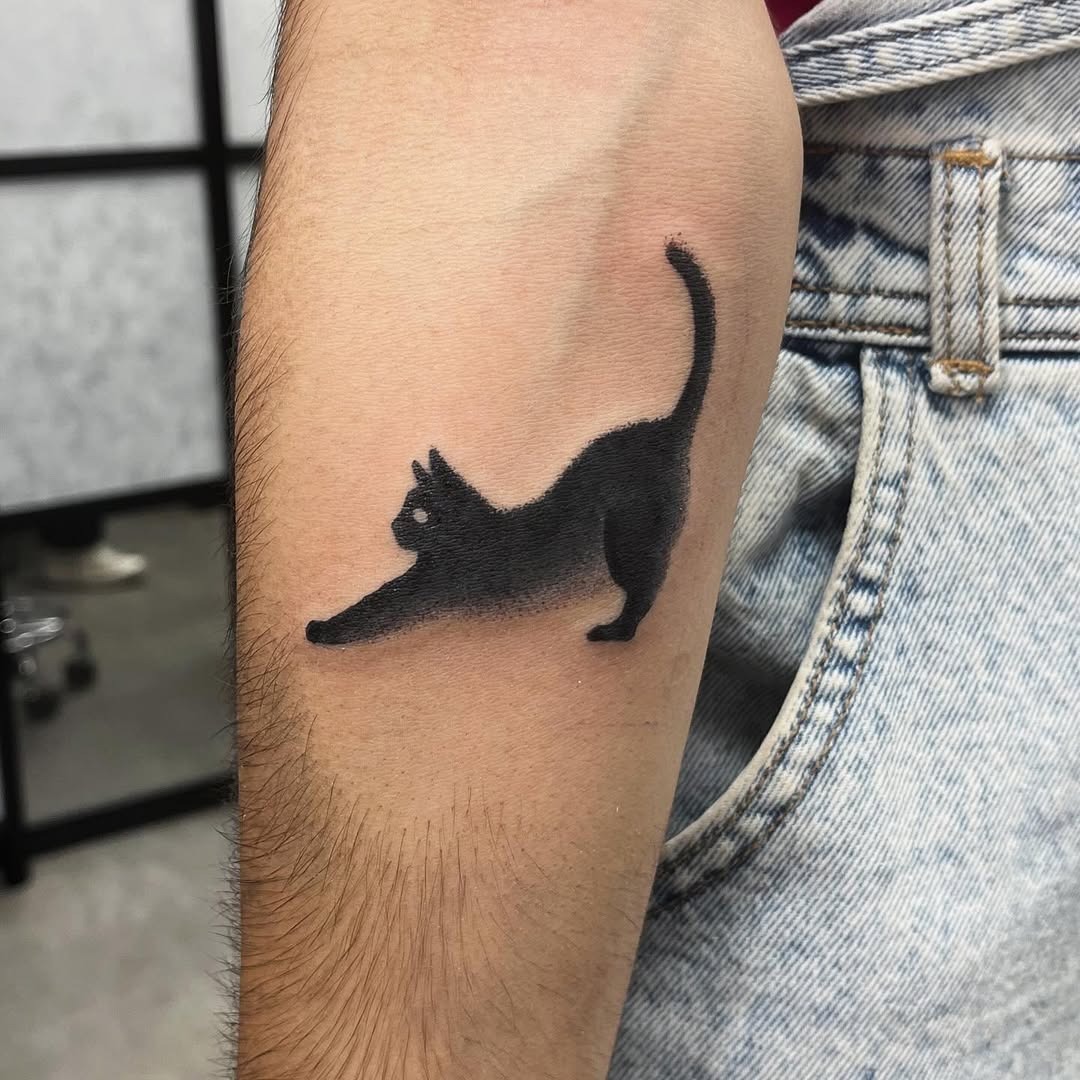Elegant black cat tattoo in a stretching pose Tattoo Design