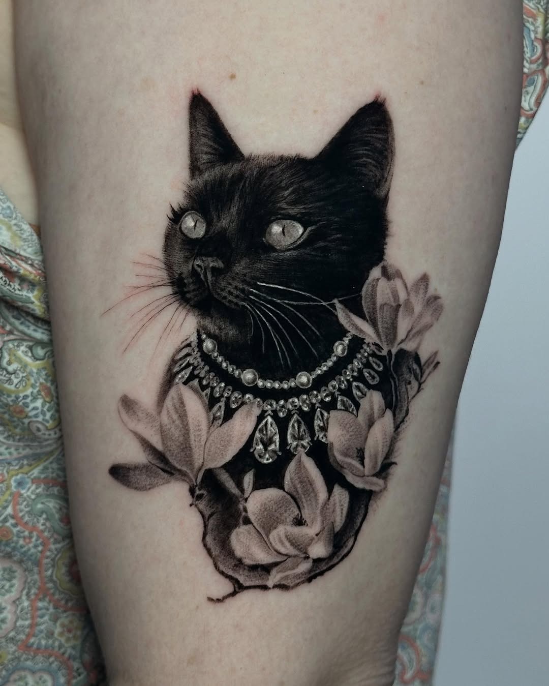 Elegant Black Cat Tattoo Surrounded by Flowers Tattoo Design
