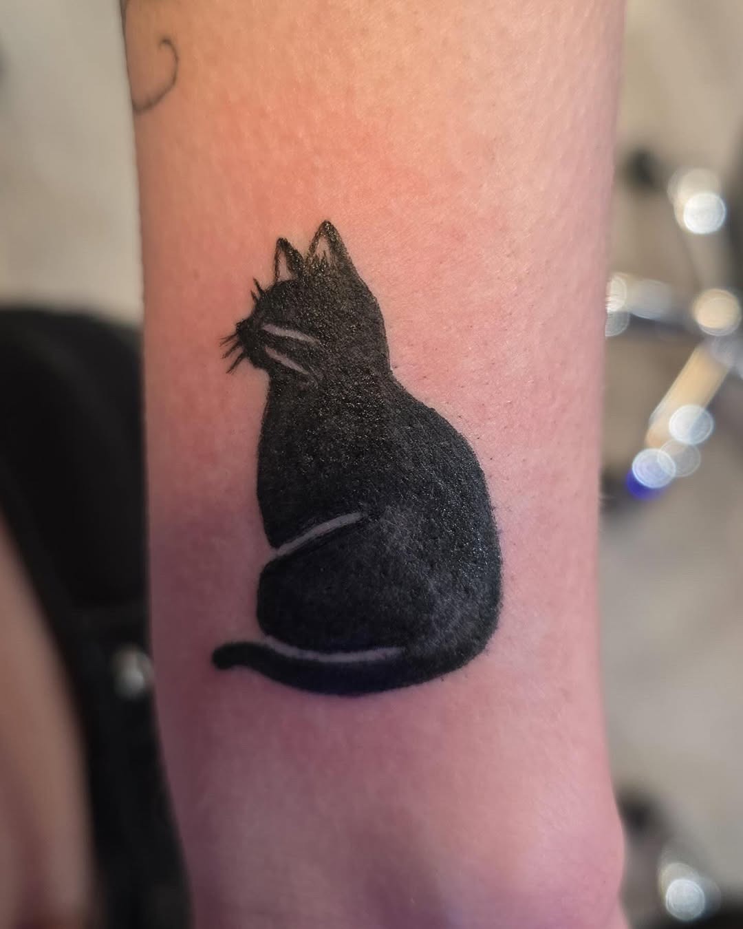 Elegant silhouette of a black cat tattoo Tattoo Design