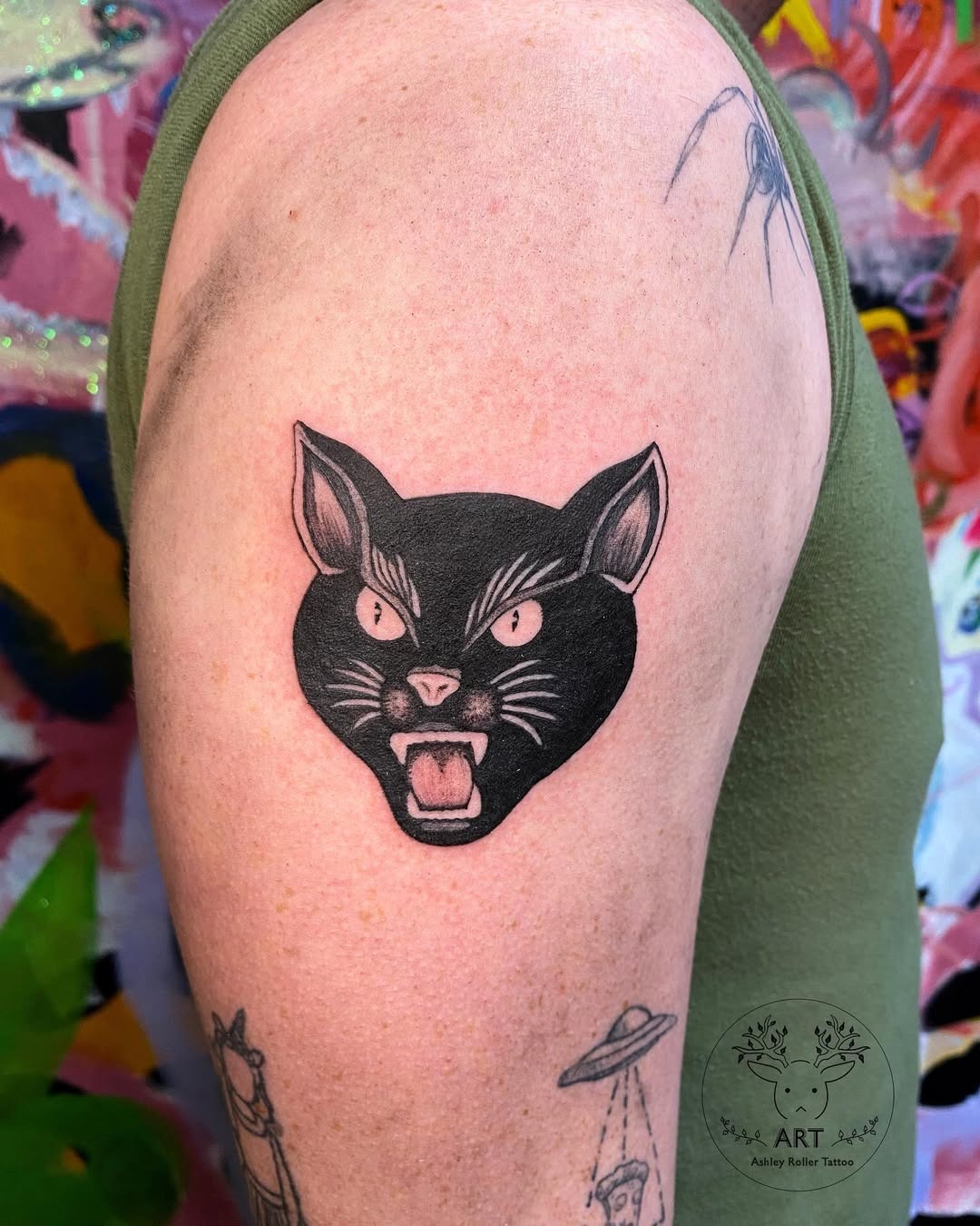 Fierce black cat tattoo design on arm Tattoo Design
