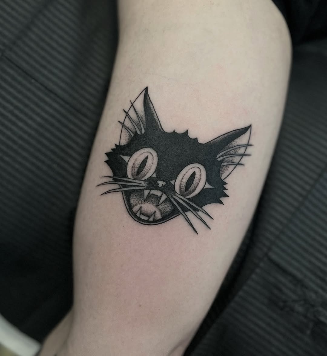 Playful black cat tattoo with striking features Tattoo Design