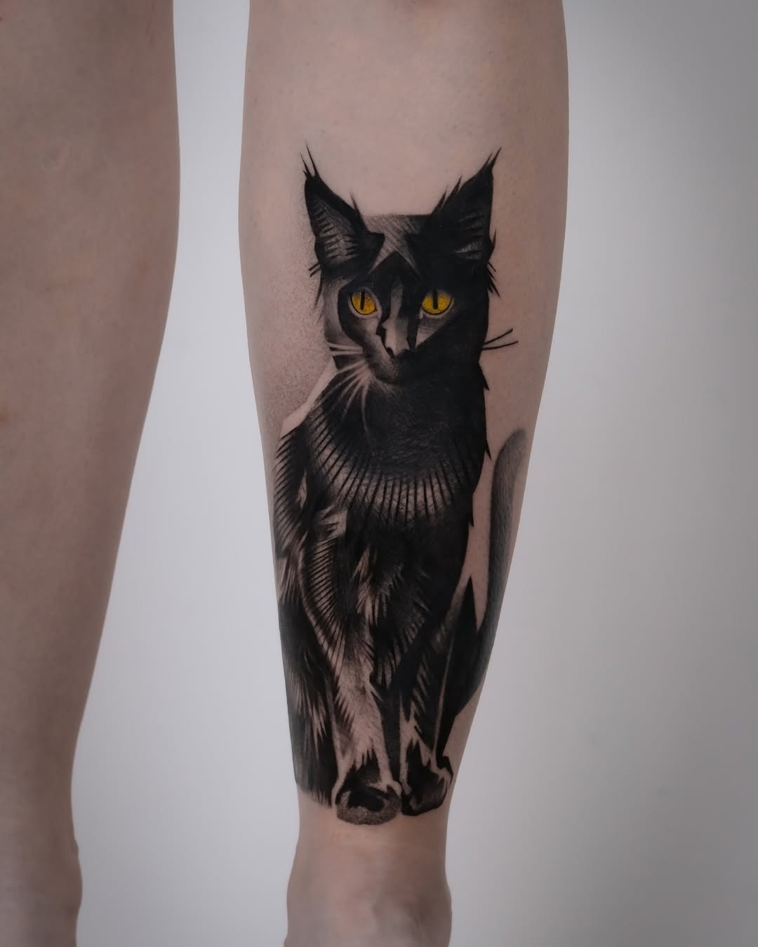 Striking black cat tattoo on the leg Tattoo Design