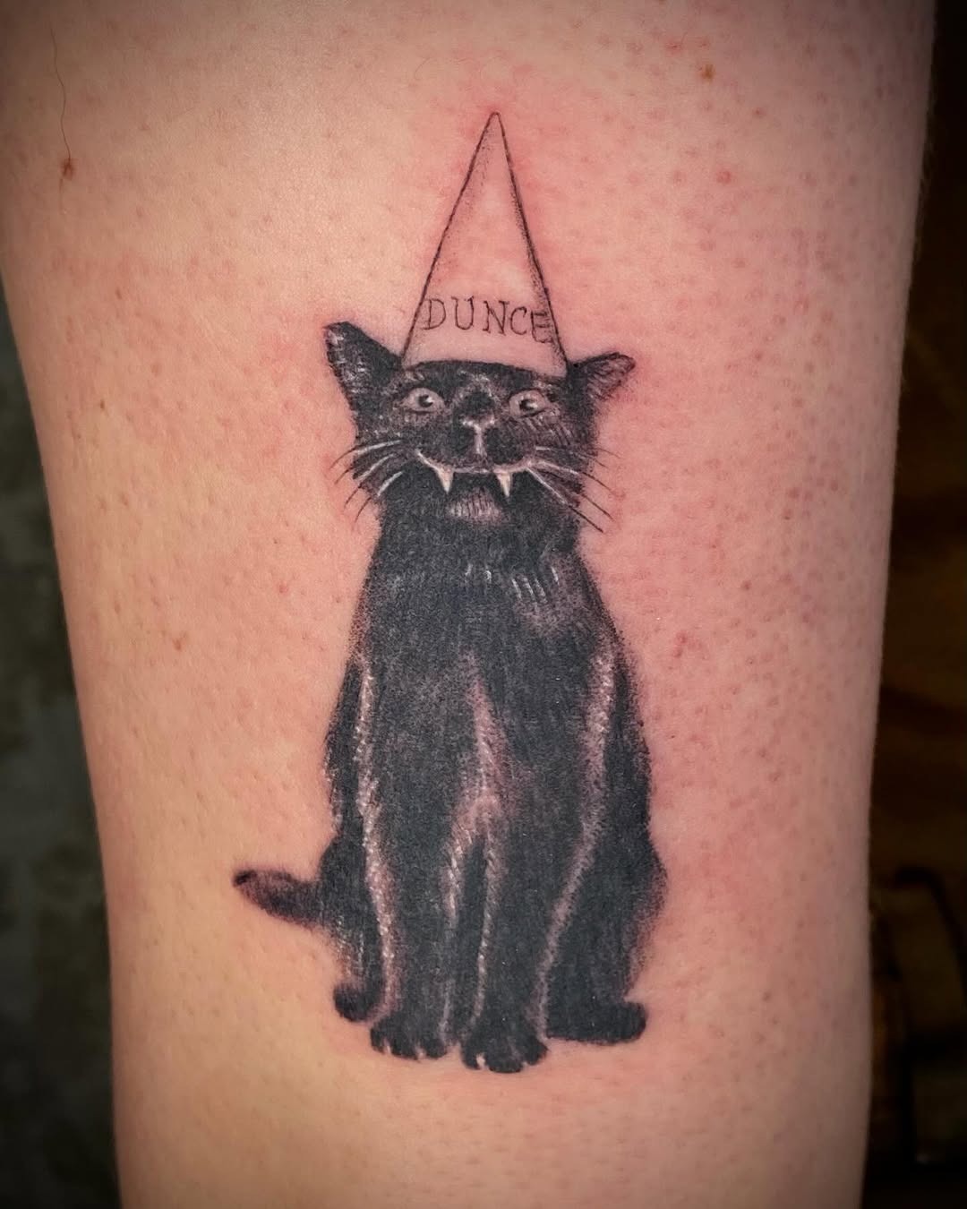 Stylish black cat tattoo with dunce cap Tattoo Design