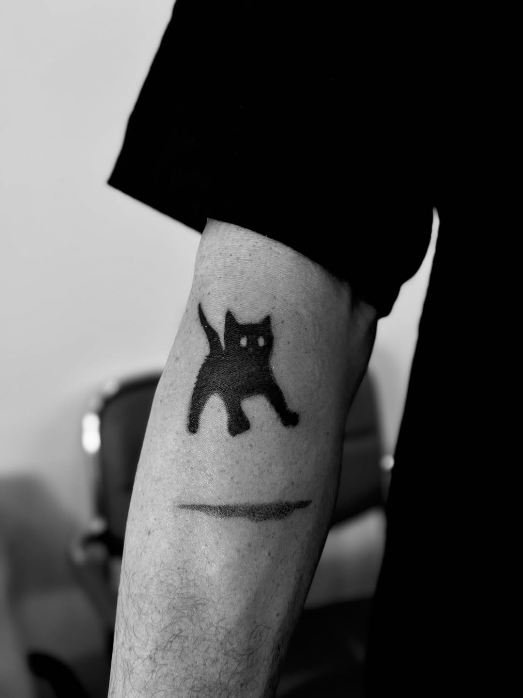 Stylish minimalist black cat tattoo design Tattoo Design