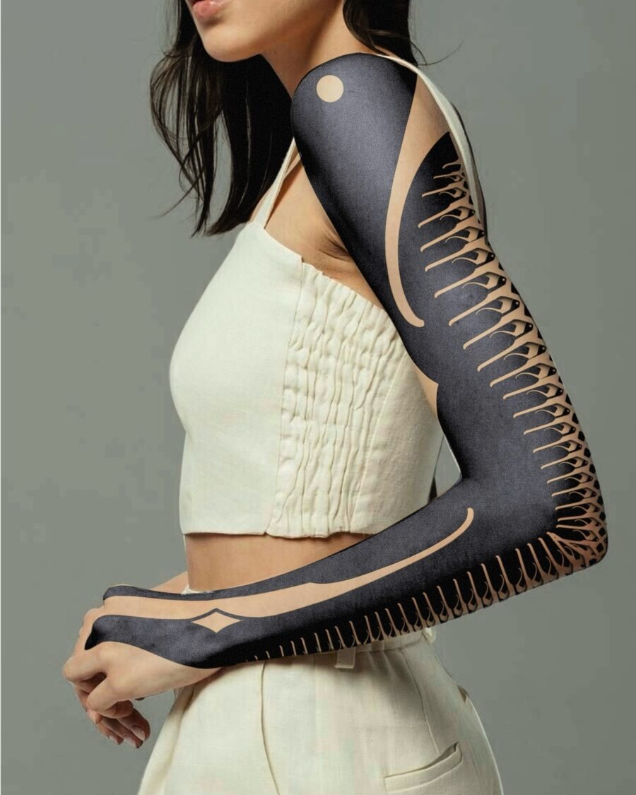This black sleeve tattoo showcases intricate design elements that flow seamlessly with the arm's contours.