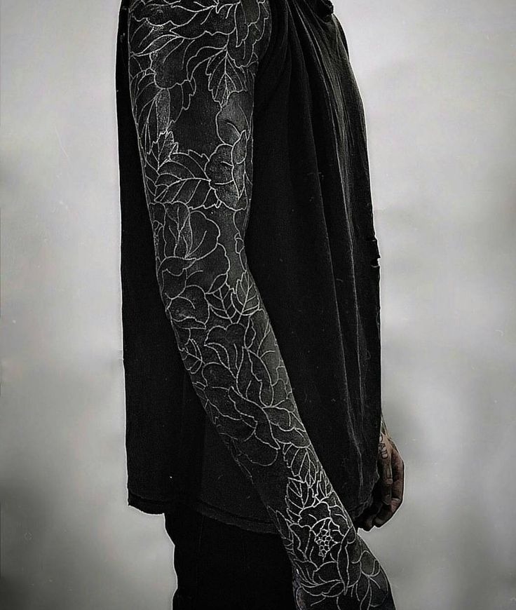 Cosmic and Surreal Blackout Arm Piece Tattoo Design