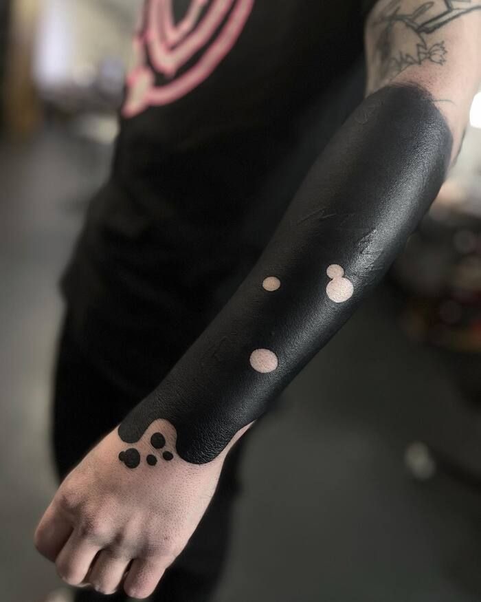 Elegant Floral Blackout Sleeve Tattoo Design