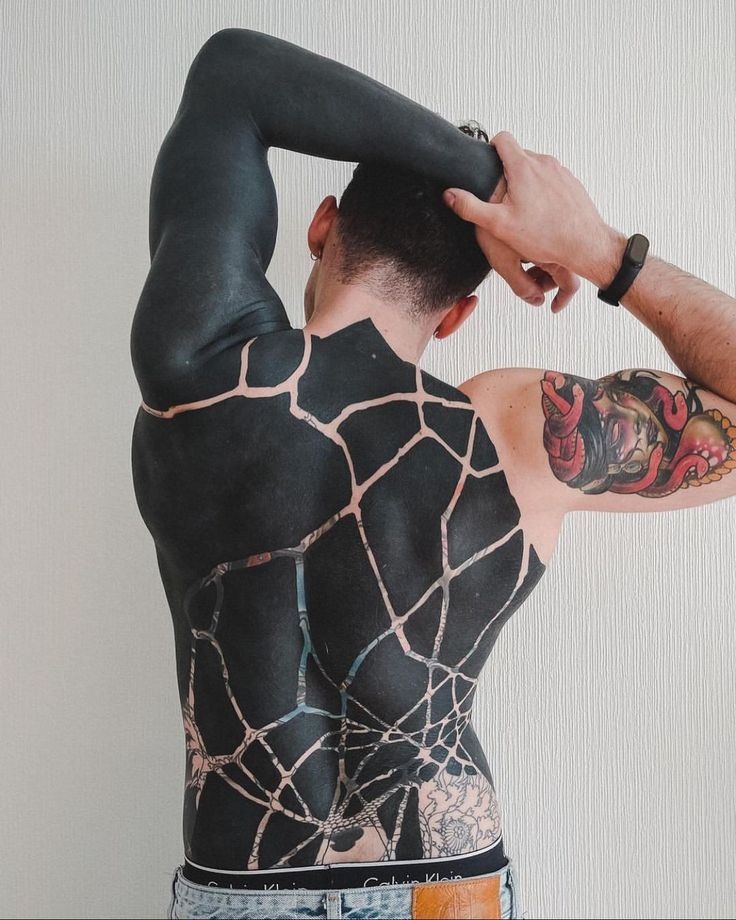 Fluid and Organic Blackout Sleeve Tattoo Design