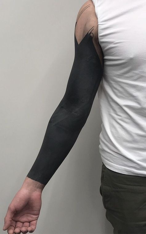 Full Arm Blackout with Artistic Cutouts Tattoo Design