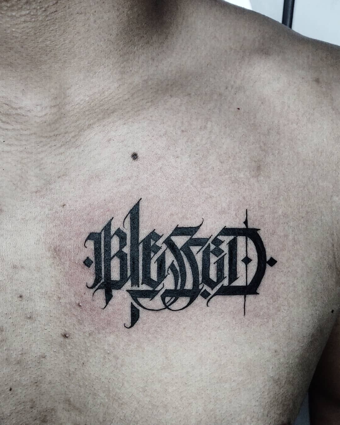 Blessed in Red Ink Script Tattoo Design