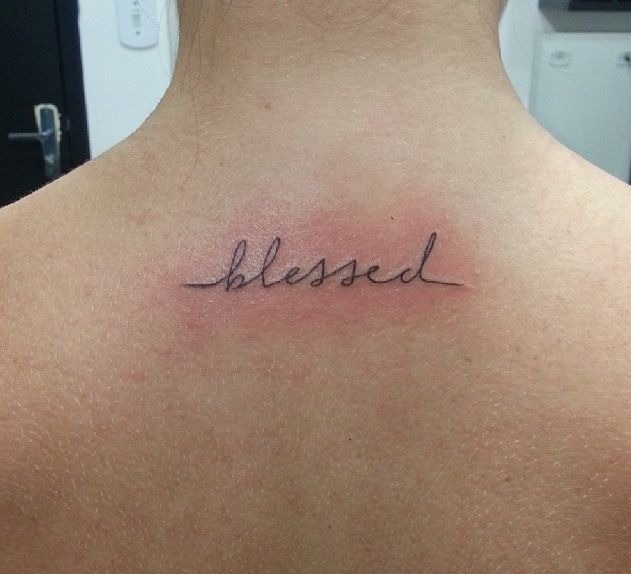 Minimal Blessed Script on Back Tattoo Design