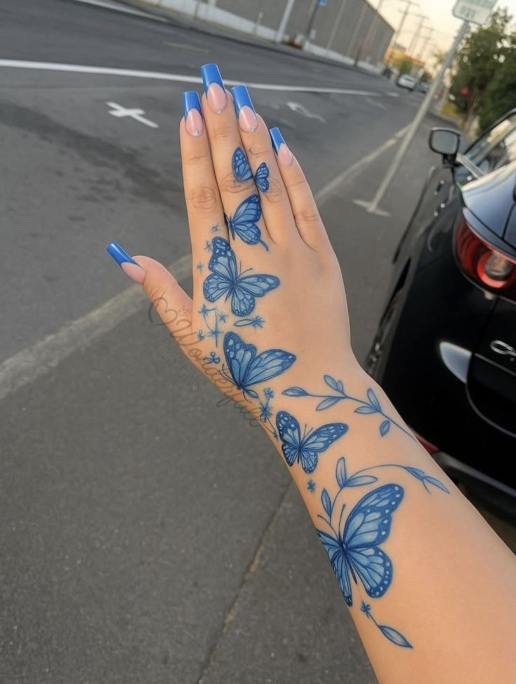 Blue Butterfly Hand and Wrist Tattoo Tattoo Design