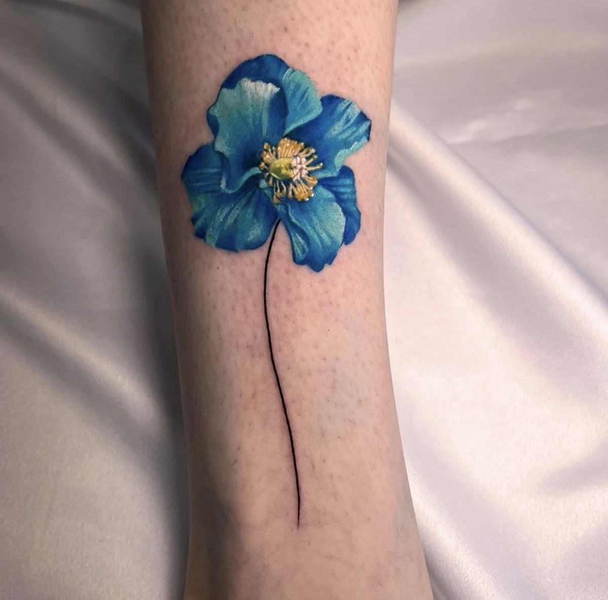 Deep Blue Poppy Stem Tattoo Tattoo Design