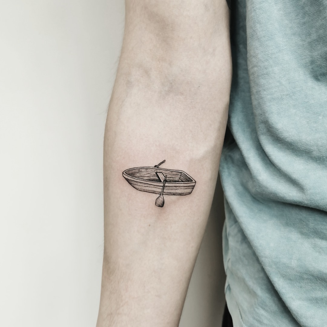 Elegant minimalist boat tattoo design on arm Tattoo Design