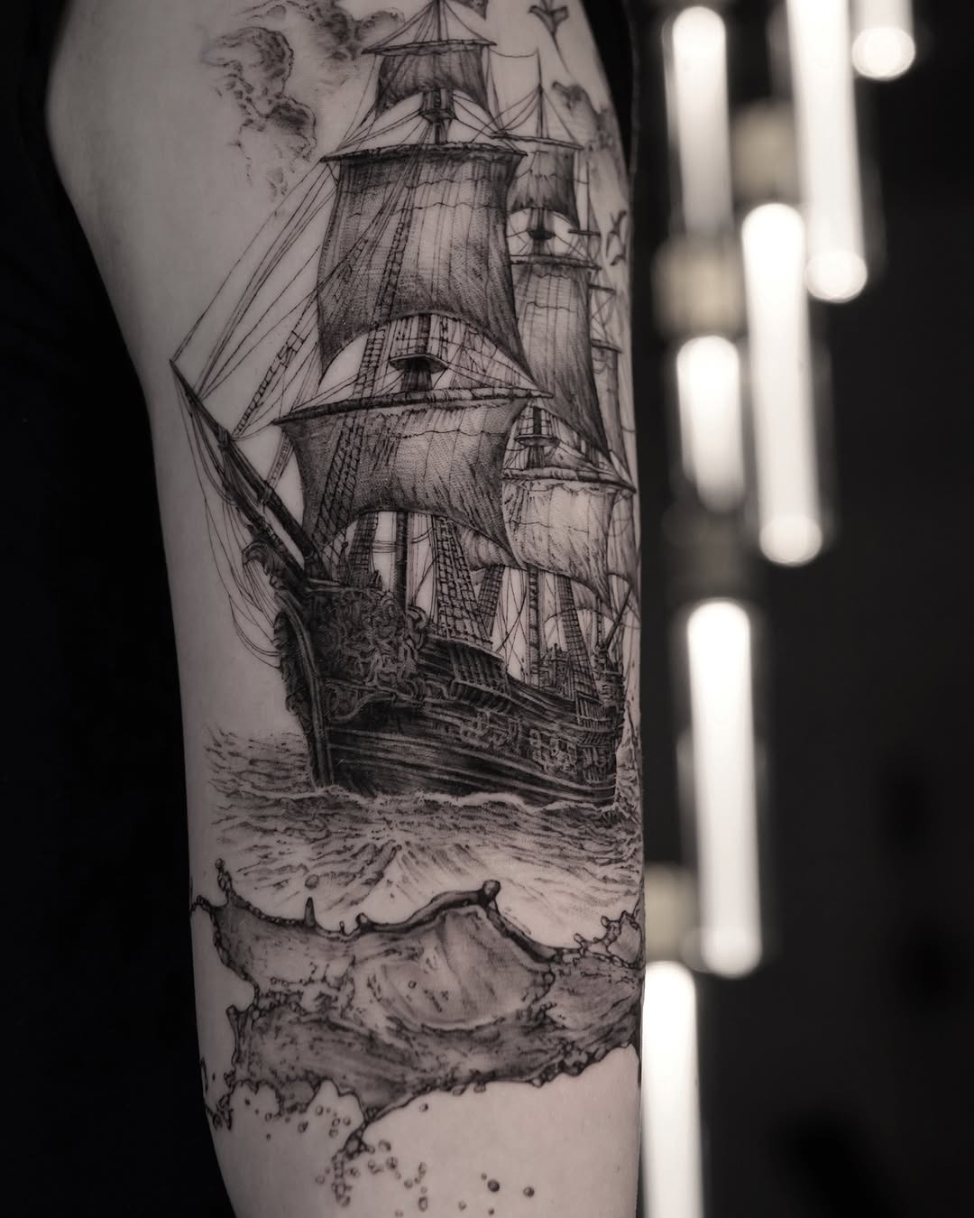 Intricate sailing ship tattoo with waves Tattoo Design