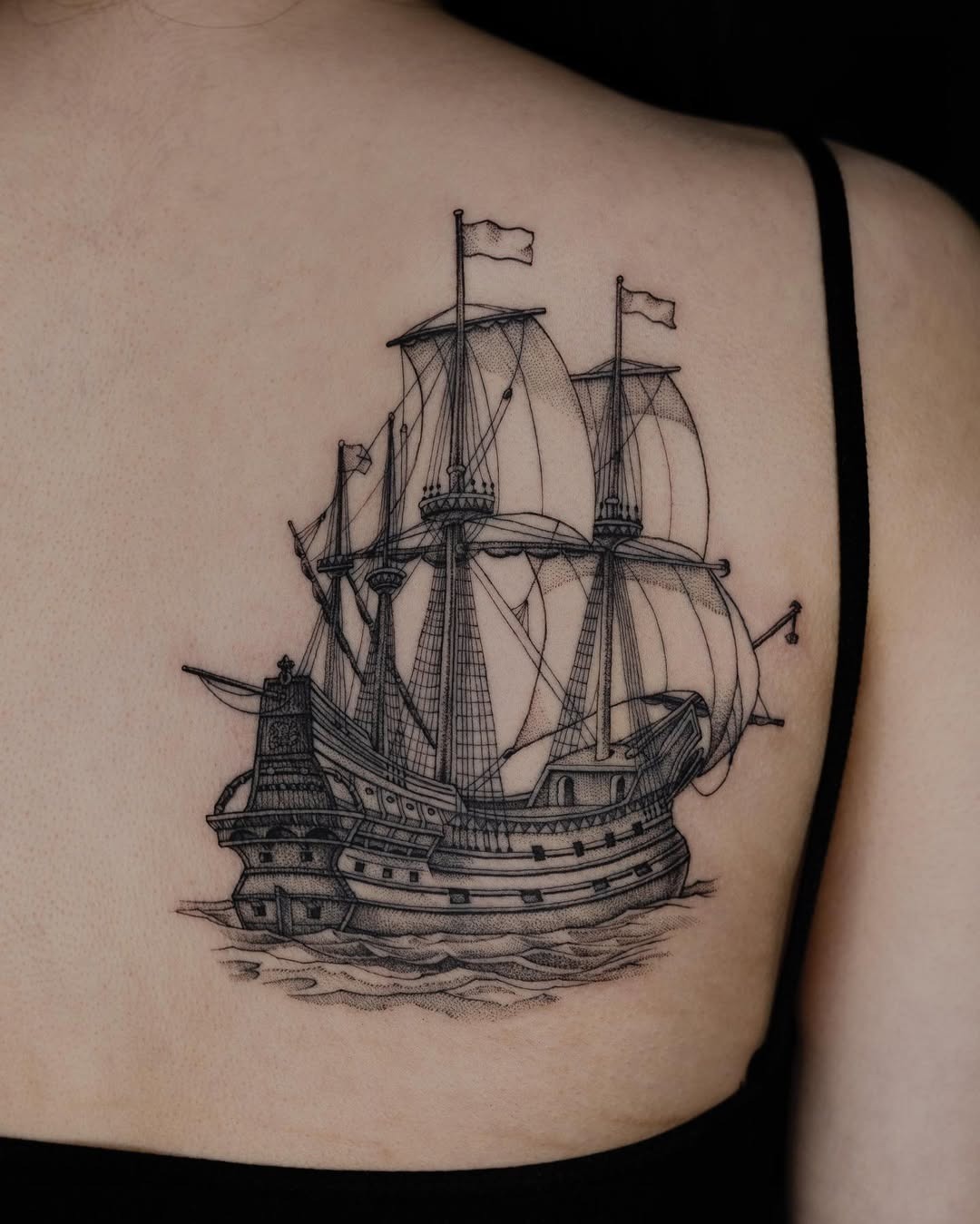 Intricate ship tattoo beautifully designed on the back Tattoo Design