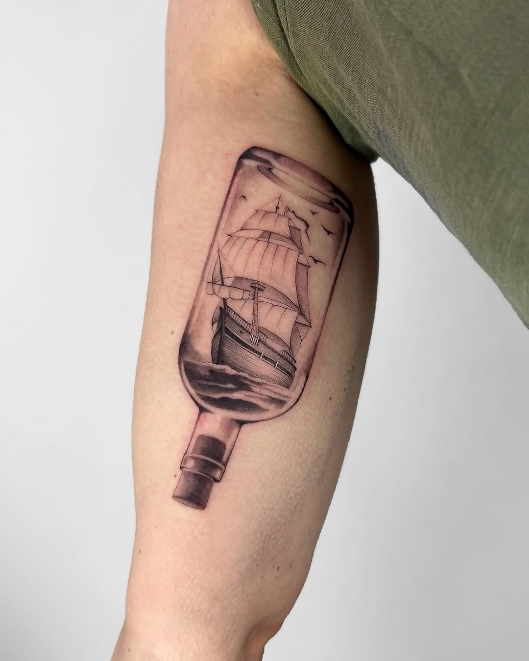 Intricate ship tattoo inside a bottle Tattoo Design