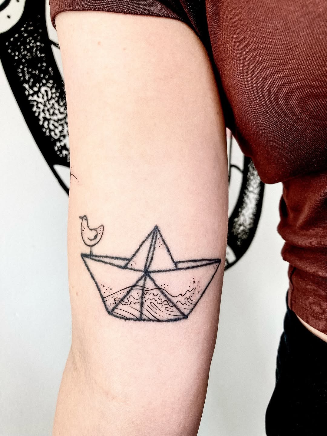 Minimalist boat tattoo with waves and bird Tattoo Design