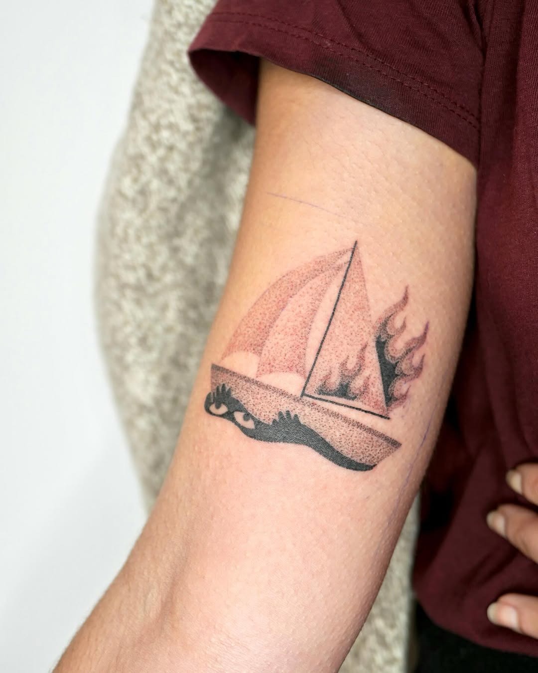 Stylish boat tattoo showcasing dynamic elements Tattoo Design