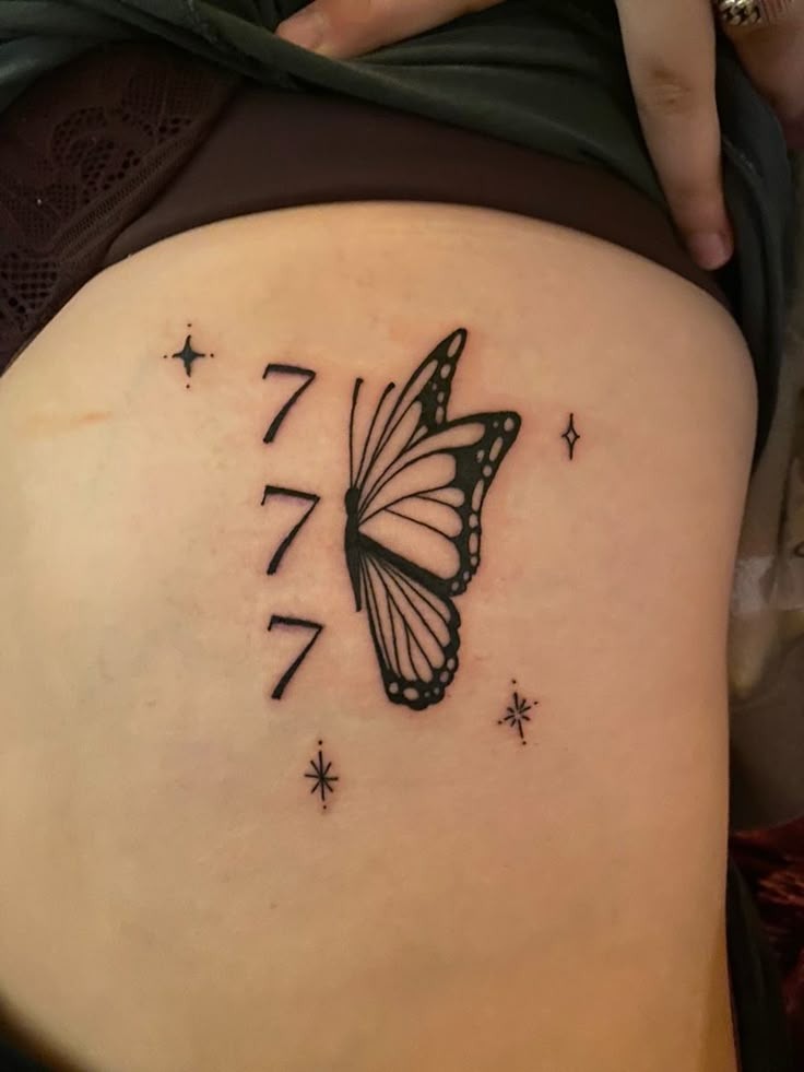 777 and Butterfly Tattoo, a tattoo design rendered in clean detailed linework.