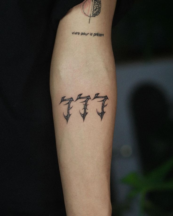 Gothic Sharp-Edged 777, a tattoo design rendered in clean detailed linework.