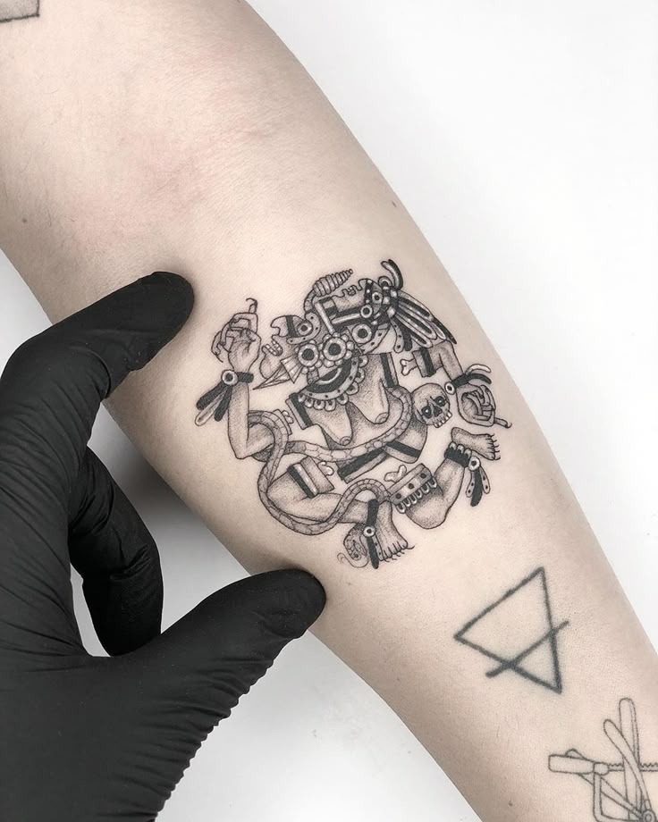 Delicate Fineline Aztec Deity Tattoo Design