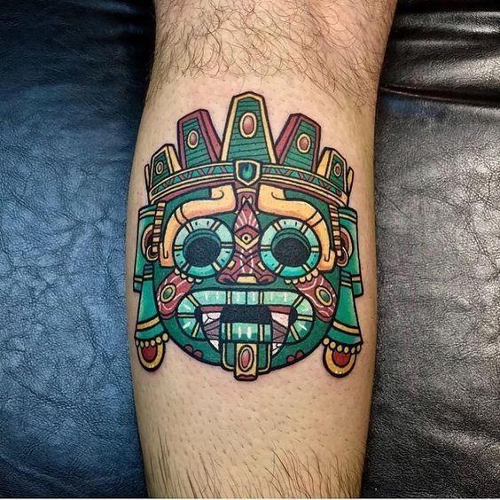 Vibrant Aztec Mask in Bold Color Tattoo Design