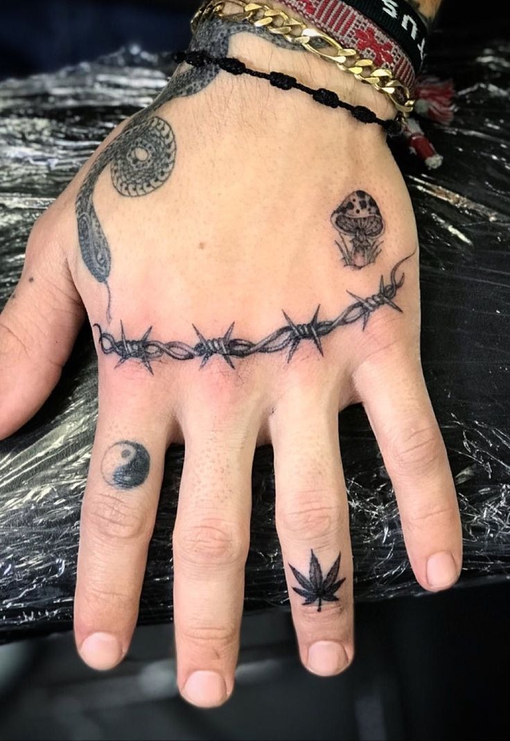 Hand Band with Symbolic Ink Tattoo Design