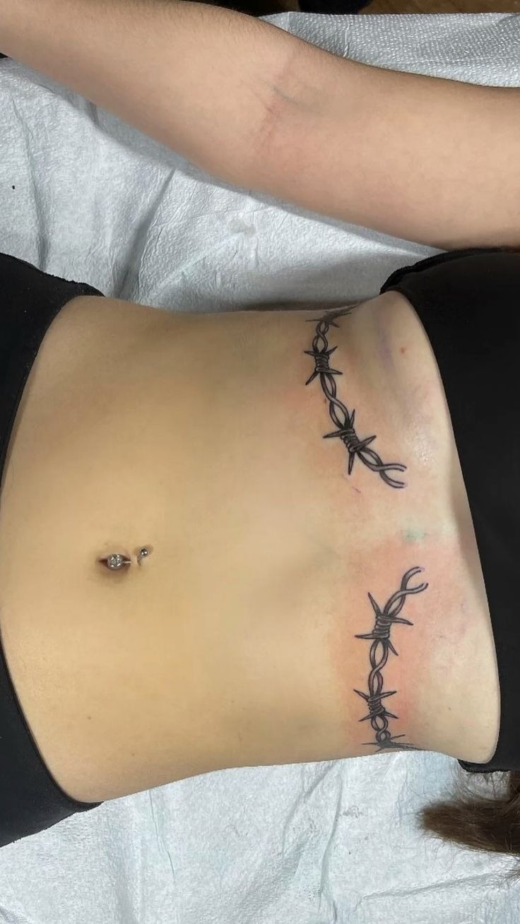 Underbust Barbed Beauty Tattoo Design