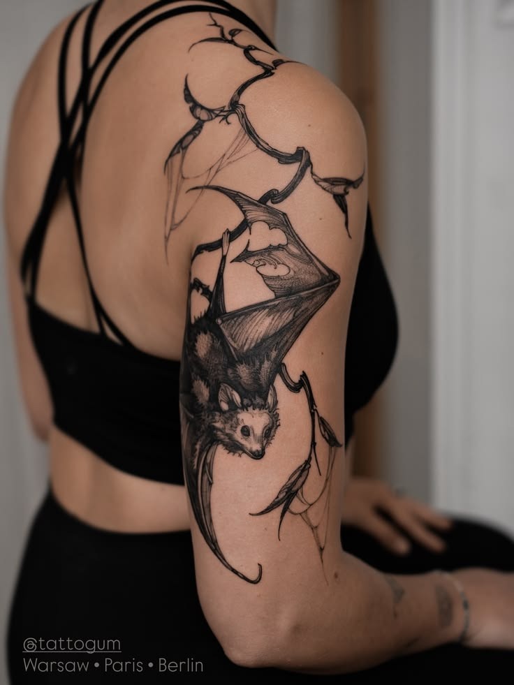 Hanging Bat with Flowing Shoulder Placement Tattoo Design