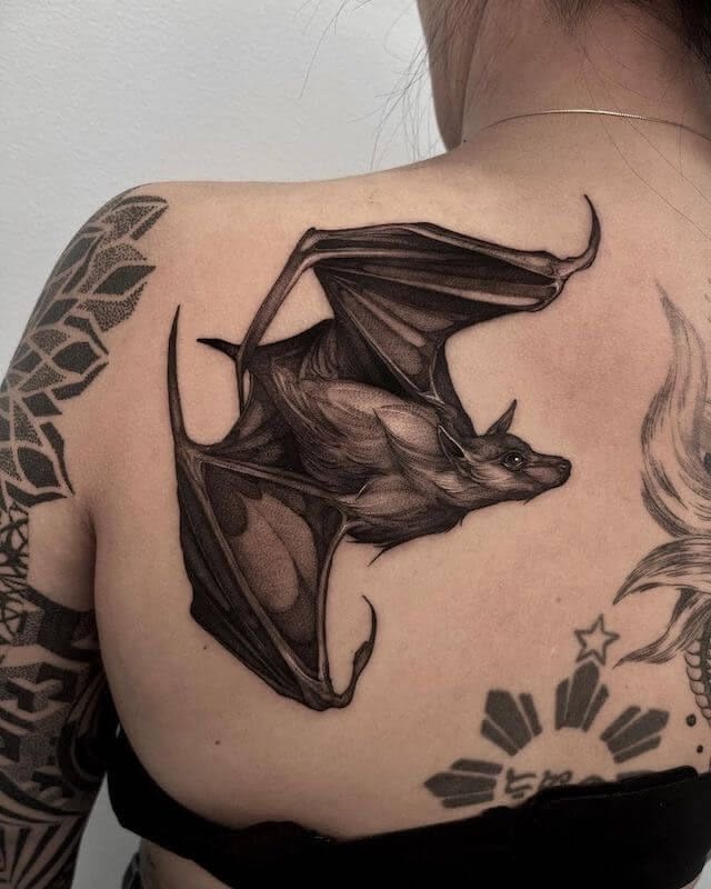 Soft Thigh Bat Trio with Starry Accents Tattoo Design