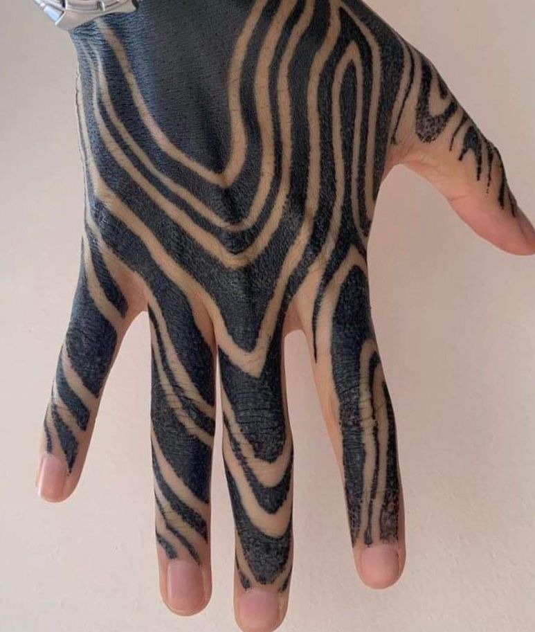 Zebra-Inspired Hand Pattern Tattoo Design