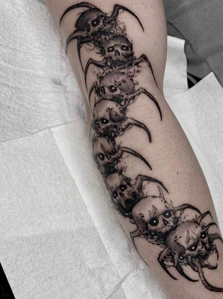 Skull-Faced Horror Centipede Tattoo Design