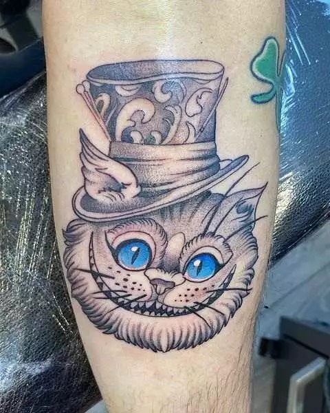 Combining two of Wonderland's most iconic characters, this tattoo features the Cheshire Cat wearing the Mad Hatter's top hat.